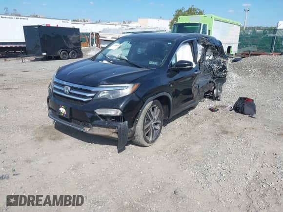 2018 Honda Pilot Touring z VIN 5FNYF6H95JB052993, wystawiony jako IAAI lot #43356643 z przebiegiem Nie podano mil oraz . Historia ofert i sprzedaży dostępna na DreamBid. Obrazek 2.