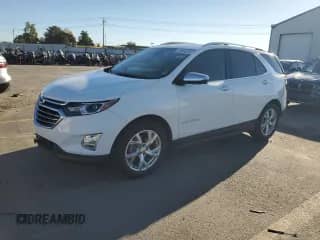2021 Chevrolet Equinox Premier z VIN 3GNAXNEV5MS152623, wystawiony jako Copart lot #85684635 z przebiegiem 74 488 mil mil oraz Szkoda całkowita • Salvage title. Historia ofert i sprzedaży dostępna na DreamBid. Obrazek 1.