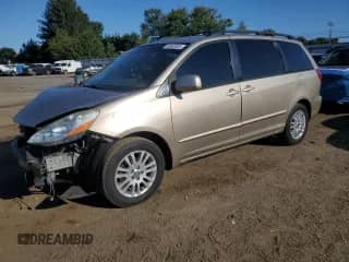 2009 Toyota Sienna XLE with VIN 5TDZK22C99S275803, listed as a Copart auction lot 80563085 with 136,403 mi miles and Salvage title. Bid and sale history available at DreamBid. Image 1.