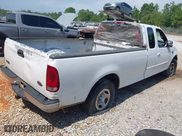 1999 Ford F-150 XL with VIN 1FTRX17L2XNB70799, listed as a IAAI auction lot 42762580 with Not provided miles and . Bid and sale history available at DreamBid. Image 4.