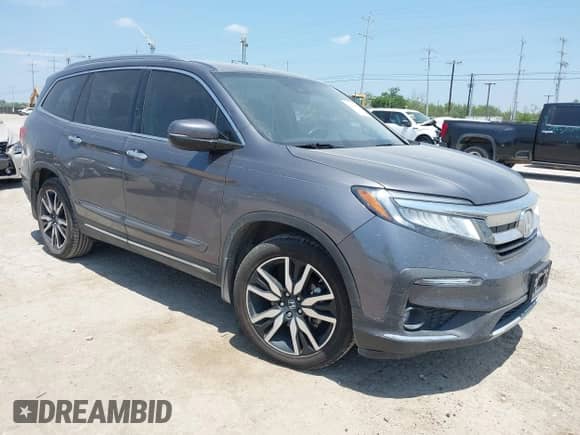 2020 Honda Pilot Touring 7-Passenger z VIN 5FNYF5H67LB021621, wystawiony jako IAAI lot #42446583 z przebiegiem 137 813 mil mil oraz . Historia ofert i sprzedaży dostępna na DreamBid. Obrazek 1.
