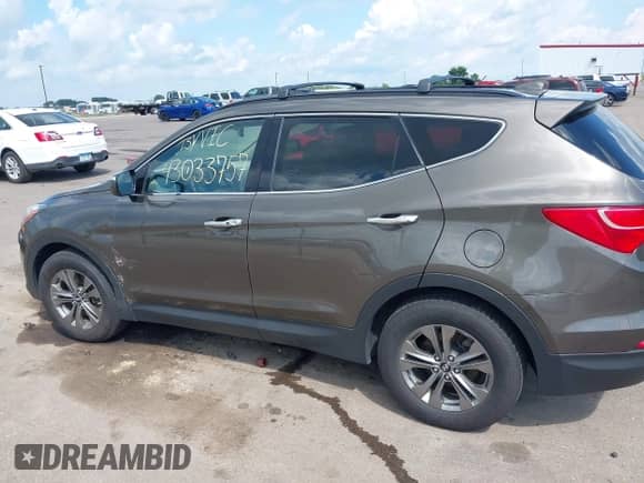 2014 Hyundai Santa Fe z VIN 5XYZUDLB1EG227778, wystawiony jako IAAI lot #43033757 z przebiegiem 135 496 mil mil oraz . Historia ofert i sprzedaży dostępna na DreamBid. Obrazek 14.