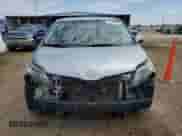 2014 Toyota Sienna SE with VIN 5TDXK3DC0ES412437, listed as a Copart auction lot 70558525 with 145,488 mi miles and Salvage title. Bid and sale history available at DreamBid. Image 5.