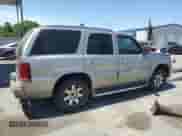 2002 Cadillac Escalade z VIN 1GYEC63T92R172834, wystawiony jako Copart lot #53606245 z przebiegiem 310 791 mil mil oraz Szkoda całkowita • Salvage title. Historia ofert i sprzedaży dostępna na DreamBid. Obrazek 3.