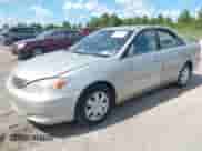 2003 Toyota Camry LE with VIN 4T1BE32K33U165706, listed as a IAAI auction lot 43134674 with 258,478 mi miles and . Bid and sale history available at DreamBid. Image 2.