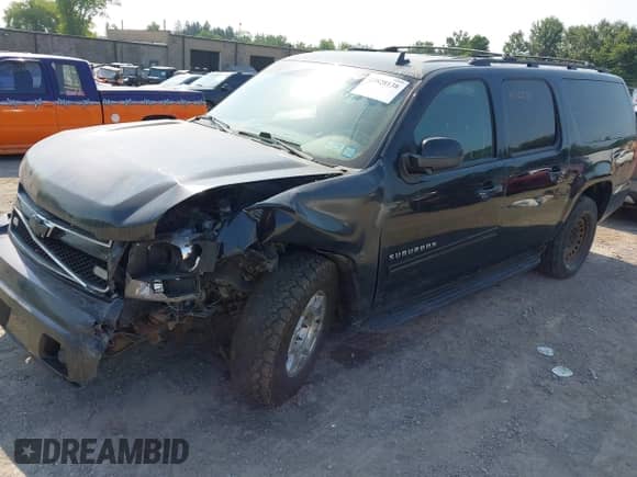 2011 Chevrolet Suburban LS z VIN 1GNSKHE33BR268213, wystawiony jako IAAI lot #42828138 z przebiegiem 168 744 mil mil oraz . Historia ofert i sprzedaży dostępna na DreamBid. Obrazek 2.