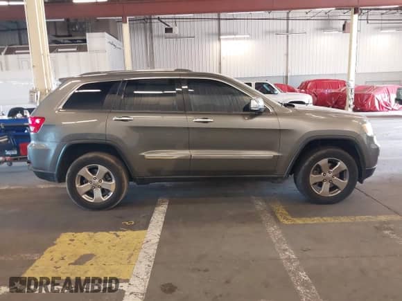 2012 Jeep Grand Cherokee Limited z VIN 1C4RJFBT9CC260334, wystawiony jako IAAI lot #42980030 z przebiegiem 186 641 mil mil oraz . Historia ofert i sprzedaży dostępna na DreamBid. Obrazek 13.