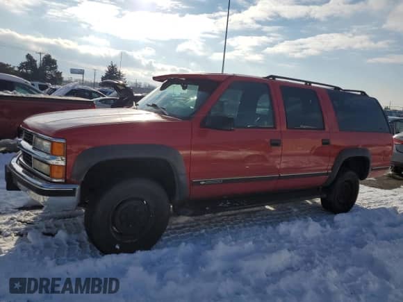 1997 Chevrolet Suburban with VIN 3GNGK26R5VG140050, listed as a Copart auction lot 87865605 with 219,522 mi miles and Salvage title. Bid and sale history available at DreamBid. Image 1.