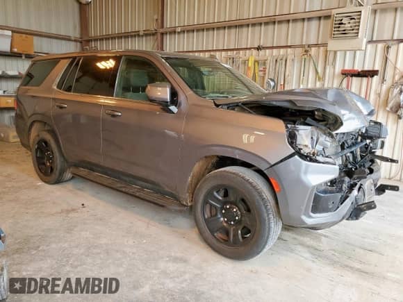 2022 Chevrolet Tahoe Commercial with VIN 1GNSCLED8NR264512, listed as a Copart auction lot 71120475 with 15,902 mi miles and Salvage title. Bid and sale history available at DreamBid. Image 4.