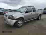 2003 Nissan Frontier SVE with VIN 1N6MD29Y13C457765, listed as a Copart auction lot 54698125 with 182,146 mi miles and Salvage title. Bid and sale history available at DreamBid. Image 1.