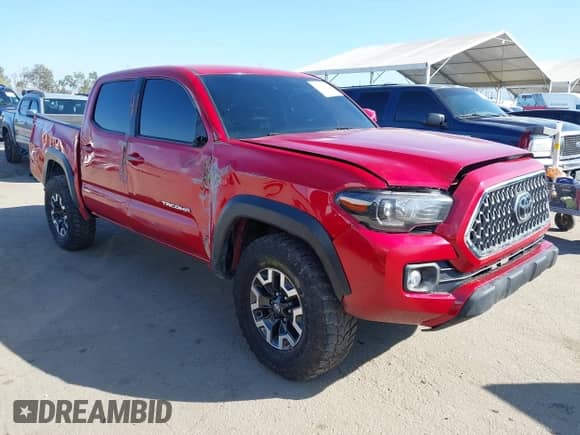 2021 Toyota Tacoma SR z VIN 5TFCZ5AN0MX262902, wystawiony jako IAAI lot #43535009 z przebiegiem 70 926 mil mil oraz . Historia ofert i sprzedaży dostępna na DreamBid. Obrazek 1.