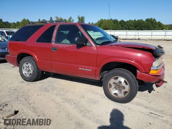 2001 Chevrolet Blazer LS с VIN 1GNCT18W61K145060, выставлен на аукционе Copart как лот 71013154 с пробегом 223 041 миль миль и Списание • Salvage title. История ставок и продаж доступна на DreamBid. Изображение 4.