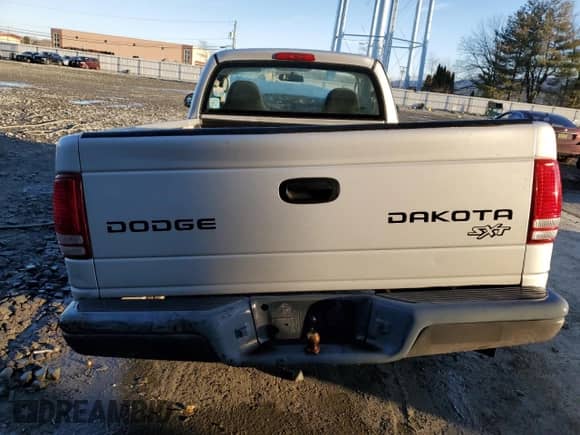 2004 Dodge Dakota z VIN 1D7FL16K94S504479, wystawiony jako Copart lot #44549325 z przebiegiem Nie podano mil oraz Szkoda całkowita • Salvage title. Historia ofert i sprzedaży dostępna na DreamBid. Obrazek 6.