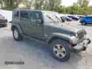 2007 Jeep Wrangler Unlimited Sahara z VIN 1J4GA59187L104520, wystawiony jako Copart lot #86331095 z przebiegiem 213 087 mil mil oraz Czysty tytuł • Clean title. Historia ofert i sprzedaży dostępna na DreamBid. Obrazek 4.