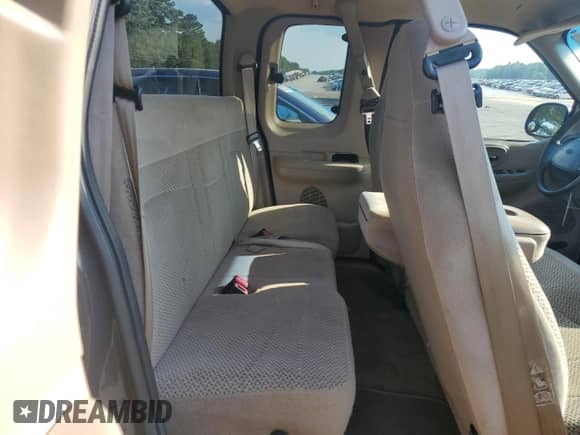 1999 Ford F-150 z VIN 1FTRX18W5XNC20636, wystawiony jako Copart lot #80905425 z przebiegiem Nie podano mil oraz Szkoda całkowita • Salvage title. Historia ofert i sprzedaży dostępna na DreamBid. Obrazek 10.