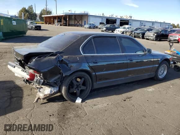 1999 BMW 7 Series 740iL with VIN WBAGH833XXDP05481, listed as a Copart auction lot 85510534 with 159,680 mi miles and Salvage title. Bid and sale history available at DreamBid. Image 3.