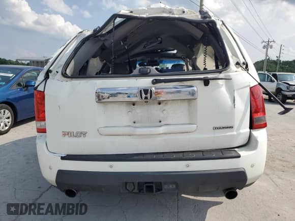 2010 Honda Pilot Touring z VIN 5FNYF3H96AB011335, wystawiony jako Copart lot #59619275 z przebiegiem Nie podano mil oraz Czysty tytuł • Clean title. Historia ofert i sprzedaży dostępna na DreamBid. Obrazek 6.