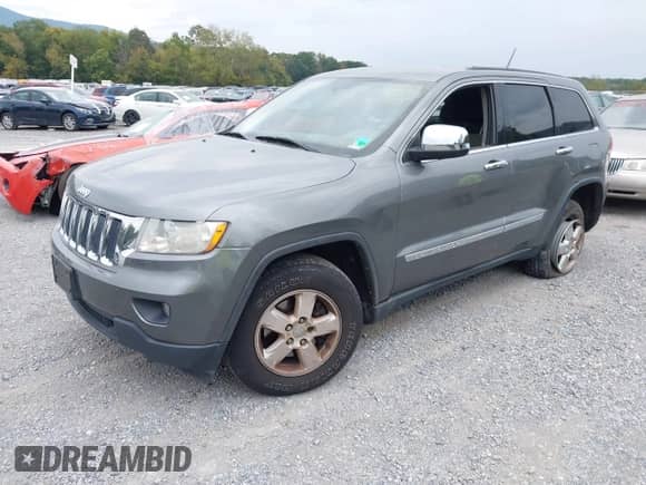 2012 Jeep Grand Cherokee Laredo with VIN 1C4RJFAG3CC272631, listed as a IAAI auction lot 43291923 with 168,220 mi miles and . Bid and sale history available at DreamBid. Image 18.