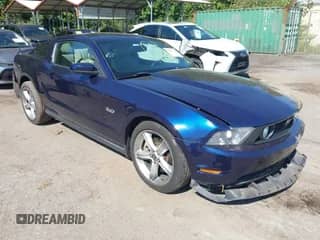 2012 Ford Mustang GT Premium z VIN 1ZVBP8CF1C5277764, wystawiony jako IAAI lot #43191730 z przebiegiem 52 459 mil mil oraz . Historia ofert i sprzedaży dostępna na DreamBid. Obrazek 1.