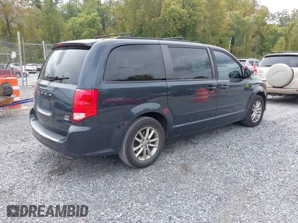 2014 Dodge Grand Caravan SXT with VIN 2C4RDGCG9ER245423, listed as a IAAI auction lot 43340034 with 228,584 mi miles and . Bid and sale history available at DreamBid. Image 4.