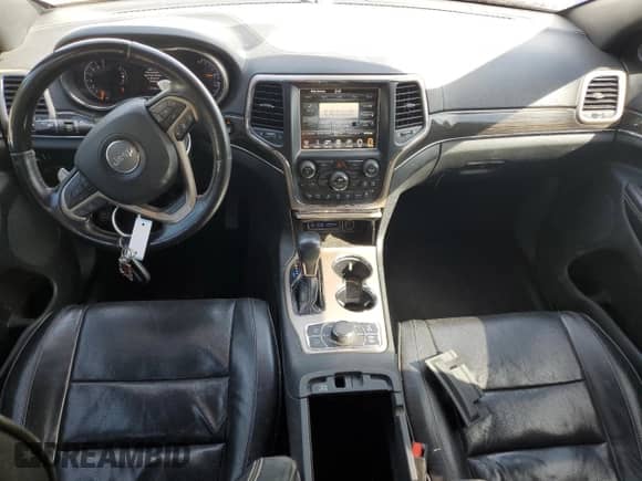 2017 Jeep Grand Cherokee Overland with VIN 1C4RJFCGXHC964499, listed as a Copart auction lot 71671795 with 117,302 mi miles and Salvage title. Bid and sale history available at DreamBid. Image 8.
