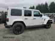 2022 Jeep Wrangler Unlimited Sahara with VIN 1C4JJXP60NW198233, listed as a Copart auction lot 69611485 with 18,908 mi miles and Salvage title. Bid and sale history available at DreamBid. Image 3.