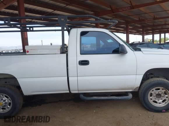 2005 Chevrolet Silverado 2500HD Work Truck with VIN 1GCHC24U05E275672, listed as a IAAI auction lot 42243540 with 179,665 mi miles and . Bid and sale history available at DreamBid. Image 14.