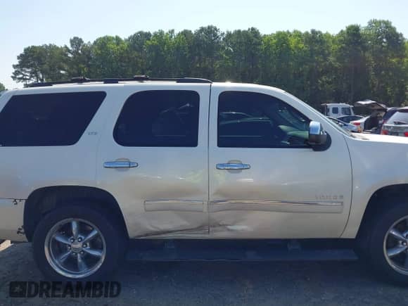 2010 Chevrolet Tahoe LTZ with VIN 1GNUKCE06AR125966, listed as a IAAI auction lot 42544013 with 243,418 mi miles and . Bid and sale history available at DreamBid. Image 13.