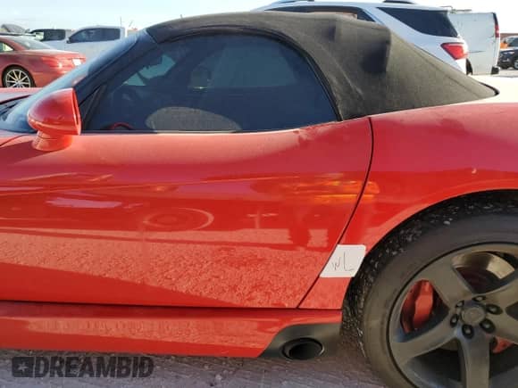 2003 Dodge Viper SRT-10 z VIN 1B3JR65Z73V501755, wystawiony jako Copart lot #76250344 z przebiegiem 43 826 mil mil oraz Nie do naprawy • Non repairable. Historia ofert i sprzedaży dostępna na DreamBid. Obrazek 12.