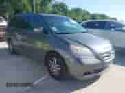 2007 Honda Odyssey EX-L z VIN 5FNRL38787B080046, wystawiony jako IAAI lot #42240227 z przebiegiem 138 073 mil mil oraz . Historia ofert i sprzedaży dostępna na DreamBid. Obrazek 1.