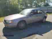 1995 Toyota Camry DX z VIN 4T1SK11E7SU494741, wystawiony jako Copart lot #59301035 z przebiegiem 180 794 mil mil oraz Szkoda całkowita • Salvage title. Historia ofert i sprzedaży dostępna na DreamBid. Obrazek 1.