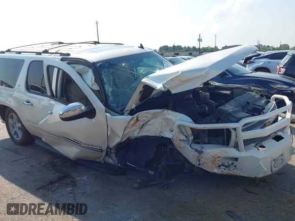 2013 Chevrolet Suburban LTZ with VIN 1GNSCKE03DR252662, listed as a IAAI auction lot 43209732 with 146,502 mi miles and . Bid and sale history available at DreamBid. Image 1.