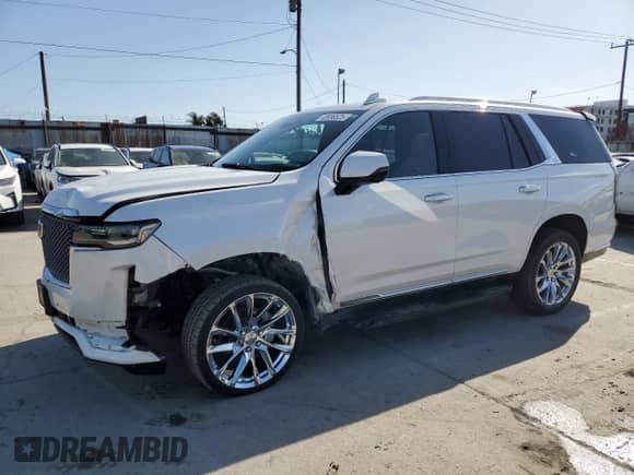 2022 Cadillac Escalade Premium Luxury с VIN 1GYS4BKL6NR153415, выставлен на аукционе Copart как лот 52036525 с пробегом 70 148 миль миль и Списание • Salvage title. История ставок и продаж доступна на DreamBid. Изображение 1.