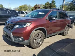 2021 Honda Passport EX-L with VIN 5FNYF8H55MB017593, listed as a Copart auction lot 82435635 with 60,637 mi miles and Salvage title. Bid and sale history available at DreamBid. Image 1.