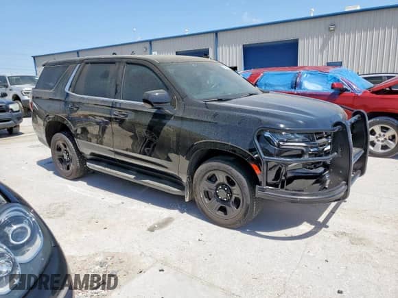 2023 Chevrolet Tahoe Commercial with VIN 1GNSCLEDXPR447042, listed as a Copart auction lot 52399275 with 22,205 mi miles and Salvage title. Bid and sale history available at DreamBid. Image 4.