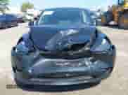 2023 Tesla Model Y Long Range z VIN 7SAYGDEE0PA201841, wystawiony jako IAAI lot #43158634 z przebiegiem 10 356 mil mil oraz . Historia ofert i sprzedaży dostępna na DreamBid. Obrazek 6.