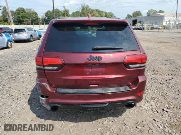 2016 Jeep Grand Cherokee SRT with VIN 1C4RJFDJ2GC373382, listed as a Copart auction lot 81557365 with 98,697 mi miles and Salvage title. Bid and sale history available at DreamBid. Image 6.