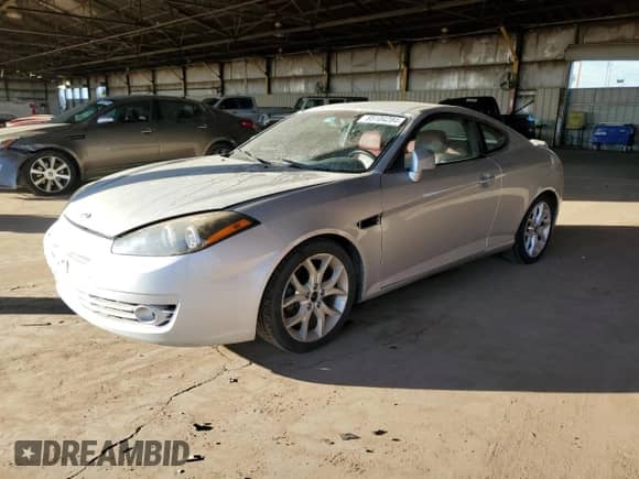 2007 Hyundai Tiburon GT с VIN KMHHN66F57U242154, выставлен на аукционе Copart как лот 85104284 с пробегом 122 242 миль миль и Чистый • Clean title. История ставок и продаж доступна на DreamBid. Изображение 1.
