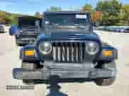 2000 Jeep Wrangler Sport with VIN 1J4FA49S1YP796600, listed as a Copart auction lot 82574545 with 128,340 mi miles and Clean title. Bid and sale history available at DreamBid. Image 5.