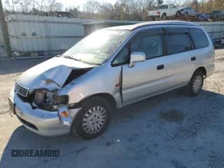 1997 Honda Odyssey with VIN RA11239041, listed as a Copart auction lot 85819024 with 79,952 mi miles and Salvage title. Bid and sale history available at DreamBid. Image 1.