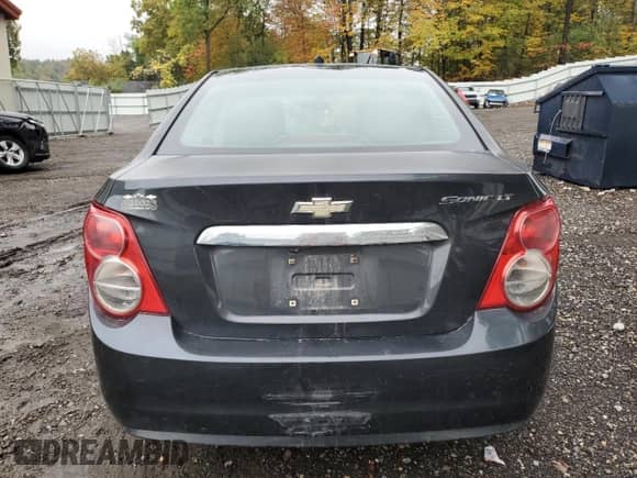 2014 Chevrolet Sonic LT с VIN 1G1JD5SH5E4187432, выставлен на аукционе Copart как лот 81255985 с пробегом 89 879 миль миль и Списание • Salvage title. История ставок и продаж доступна на DreamBid. Изображение 6.