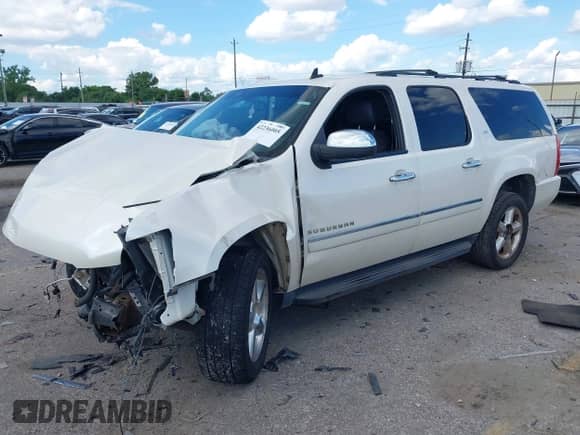 2014 Chevrolet Suburban LTZ with VIN 1GNSCKE08ER150520, listed as a IAAI auction lot 42236005 with 215,013 mi miles and . Bid and sale history available at DreamBid. Image 2.