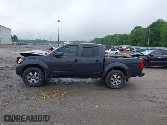 2013 Nissan Frontier SV with VIN 1N6AD0EV7DN761871, listed as a IAAI auction lot 42073290 with 150,412 mi miles and . Bid and sale history available at DreamBid. Image 14.
