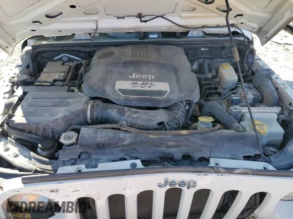 2012 Jeep Wrangler Sport with VIN 1C4AJWAG5CL220348, listed as a Copart auction lot 69854545 with 124,454 mi miles and Salvage title. Bid and sale history available at DreamBid. Image 12.