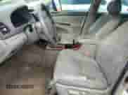 2005 Toyota Camry LE с VIN JTDBF30K050163989, выставлен на аукционе Copart как лот 69534195 с пробегом 289 449 миль миль и Списание • Salvage title. История ставок и продаж доступна на DreamBid. Изображение 7.