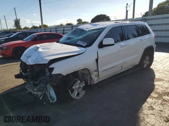 2014 Jeep Grand Cherokee Laredo with VIN 1C4RJEAG7EC433222, listed as a Copart auction lot 82676095 with 83,343 mi miles and Salvage title. Bid and sale history available at DreamBid. Image 1.
