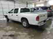 2002 Dodge Dakota Sport z VIN 1B7HL38XX2S650989, wystawiony jako Copart lot #73746534 z przebiegiem 392 280 mil mil oraz Szkoda całkowita • Salvage title. Historia ofert i sprzedaży dostępna na DreamBid. Obrazek 3.