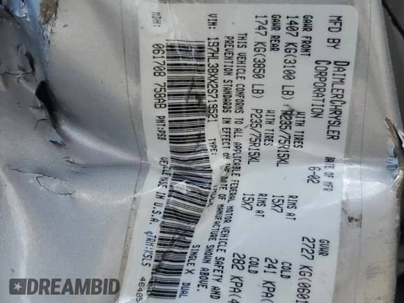 2002 Dodge Dakota Sport z VIN 1B7HL38XX2S719521, wystawiony jako Copart lot #56207725 z przebiegiem 118 119 mil mil oraz Szkoda całkowita • Salvage title. Historia ofert i sprzedaży dostępna na DreamBid. Obrazek 12.