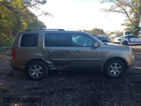 2009 Honda Pilot Touring with VIN 5FNYF48979B007005, listed as a IAAI auction lot 43454497 with 128,268 mi miles and . Bid and sale history available at DreamBid. Image 13.