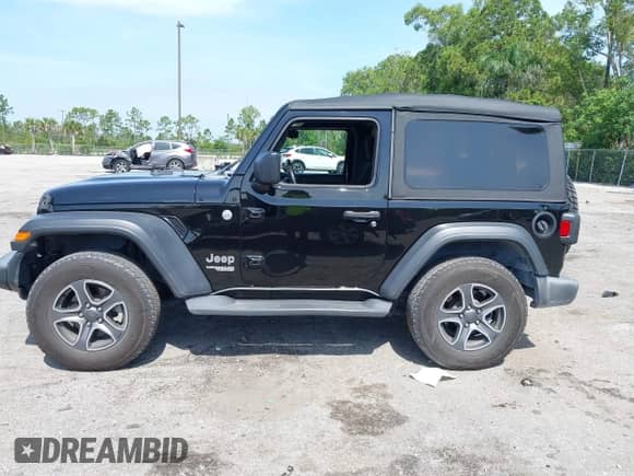 2019 Jeep Wrangler Sport S with VIN 1C4GJXAG2KW664395, listed as a IAAI auction lot 42683888 with 72,742 mi miles and . Bid and sale history available at DreamBid. Image 14.